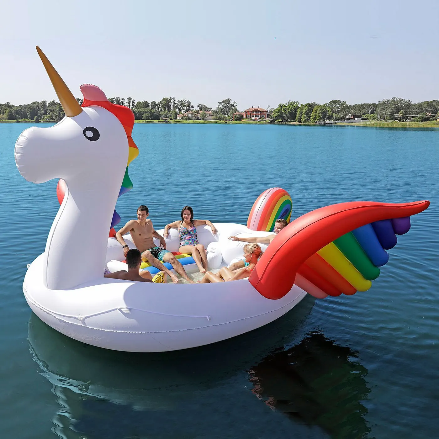 Giant six-person unicorn pool float on a lake