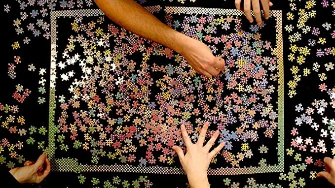 Colorful gradient jigsaw puzzle with vibrating polka dot pattern